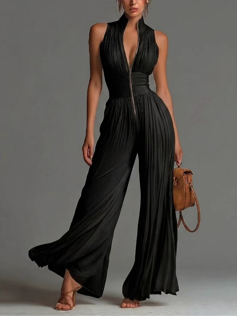 White sleeveless chiffon jumpsuit with V-neck, zipper, and wide pleated pants
